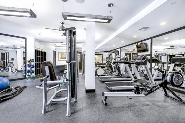 State-of-the-art fitness center with modern equipment at Pressler Apartments for active living in a luxurious community