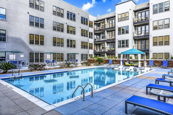 Relaxing rooftop pool offering skyline views at Pressler Apartments in Austin, a prime Greystar luxury property