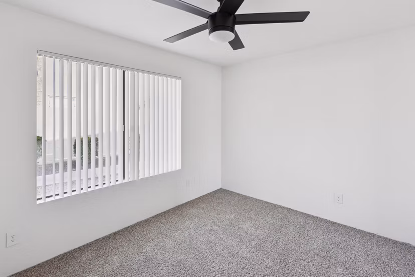 Modern bedroom with stylish decor and large windows at Be Mesa Apartments