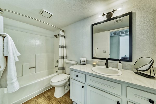 Modern bathroom featuring sleek fixtures and ample lighting at Be Mesa Apartments