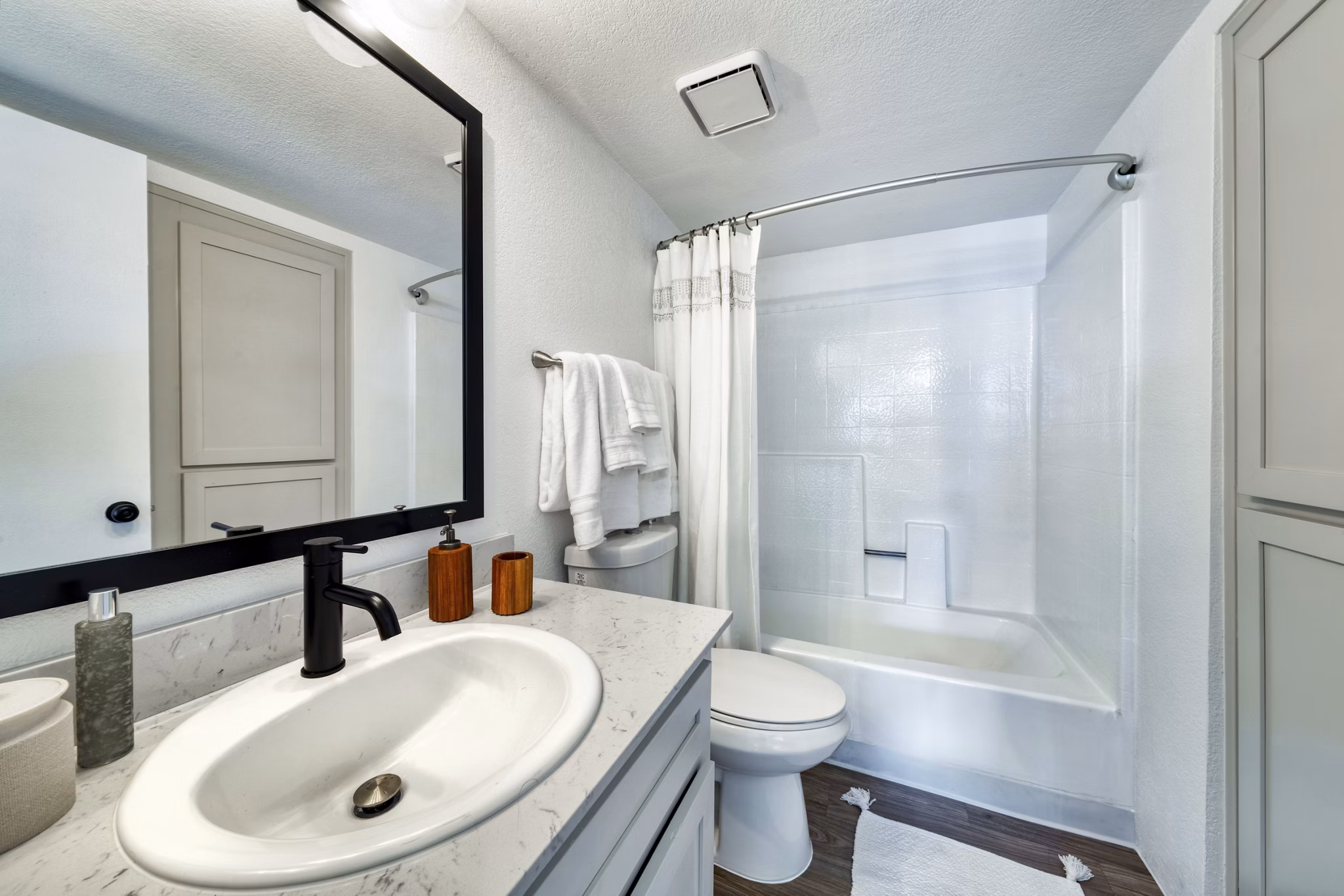 Modern bathroom with marble finishes at Be Mesa Apartments, a luxury living option by Greystar