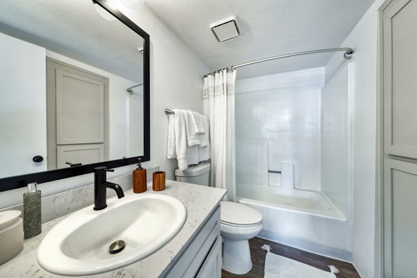 Modern bathroom with marble finishes at Be Mesa Apartments, a luxury living option by Greystar