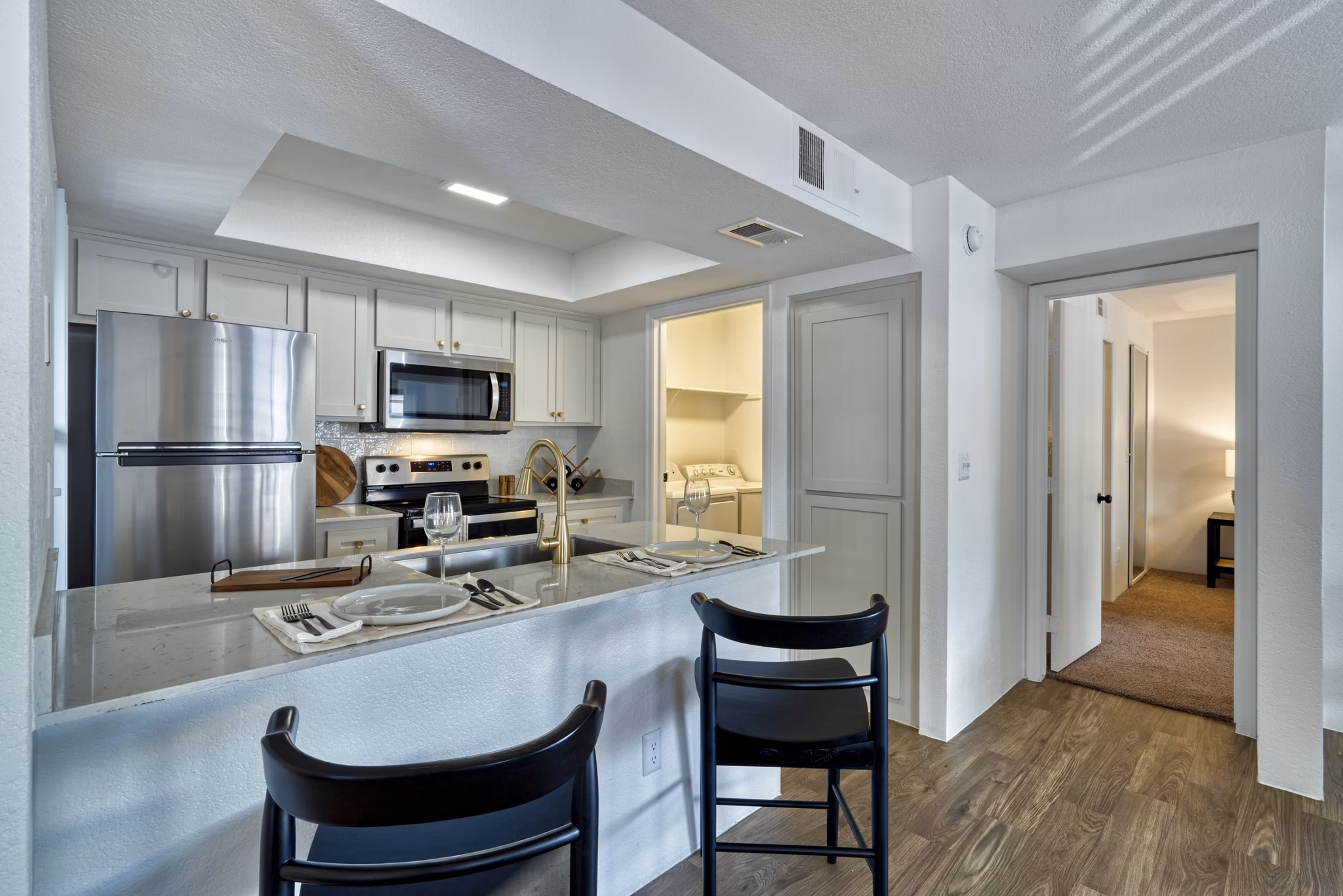 Modern kitchen with stainless steel appliances at Be Mesa Apartments, offering luxury living experiences