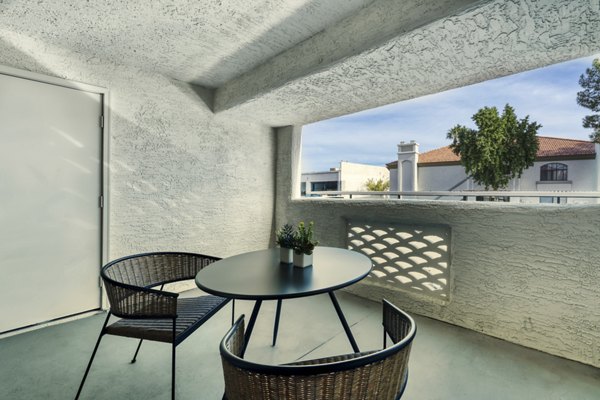 Patio featuring outdoor seating and lush landscaping at Be Mesa Apartments, a luxury property in a prime location