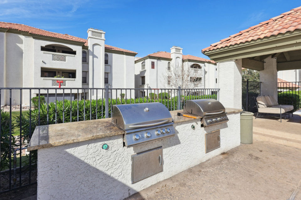 Patio featuring outdoor seating and lush landscaping at Be Mesa Apartments, a luxury property in a prime location