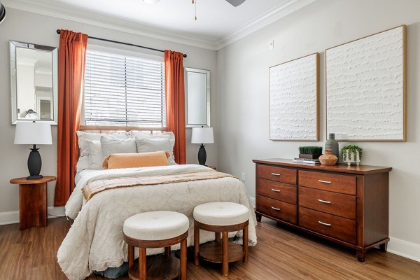 Bedroom featuring elegant decor and plush bedding at Lantana Hills Apartments, a luxury community by Greystar