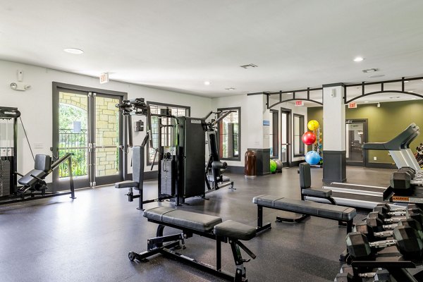 Modern fitness center with state-of-the-art equipment at Lantana Hills Apartments, offering luxury living by Greystar