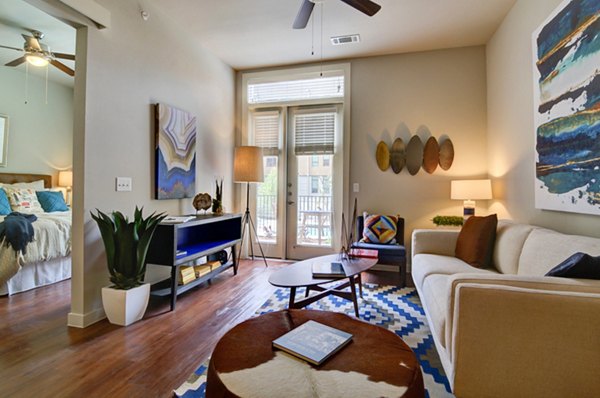 Spacious living room with modern decor at River House Apartments