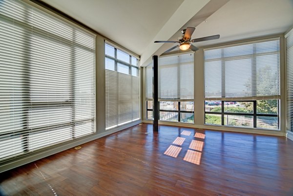 Spacious living room with contemporary furnishings in River House Apartments