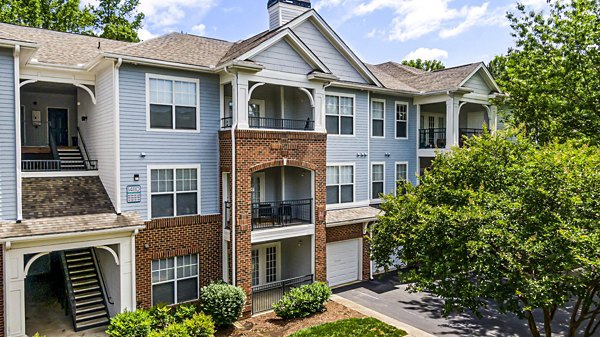 Columns at Wakefield: Elegant architecture and lush landscaping surrounding luxury apartment community