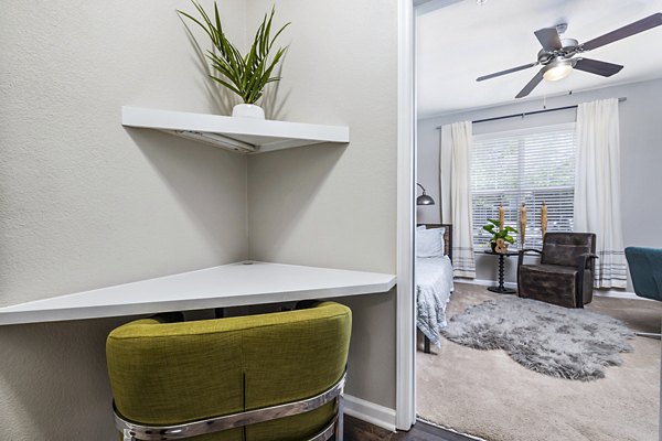 Cozy bedroom featuring a corner desk in Columns at Wakefield apartments