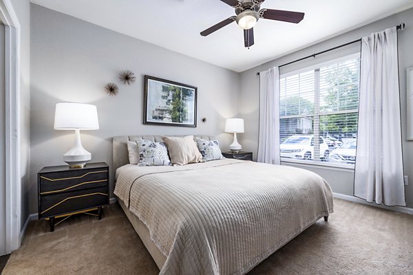 Bedroom featuring elegant decor and natural light at Columns at Wakefield luxury apartments