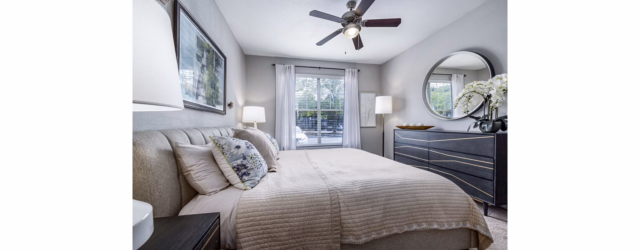 Elegant bedroom featuring a king-sized bed and modern decor in Columns at Wakefield luxury apartments