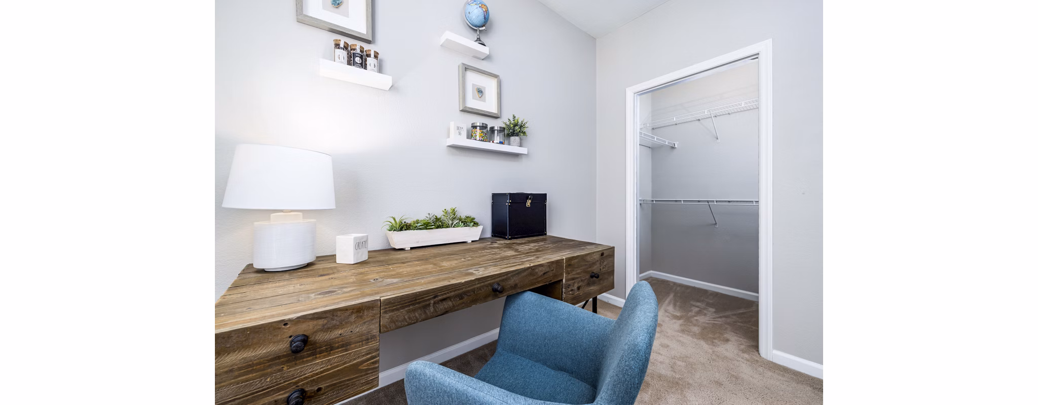 Modern bedroom/home office with natural light at Columns at Wakefield luxury apartments