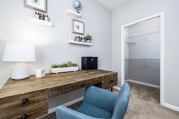 Modern bedroom/home office with natural light at Columns at Wakefield luxury apartments