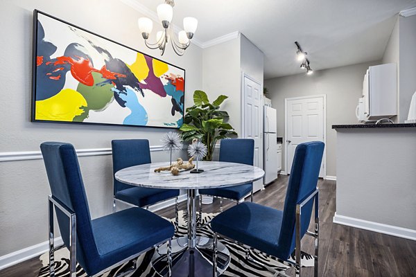 Dining room featuring elegant lighting and modern decor in Columns at Wakefield luxury apartments