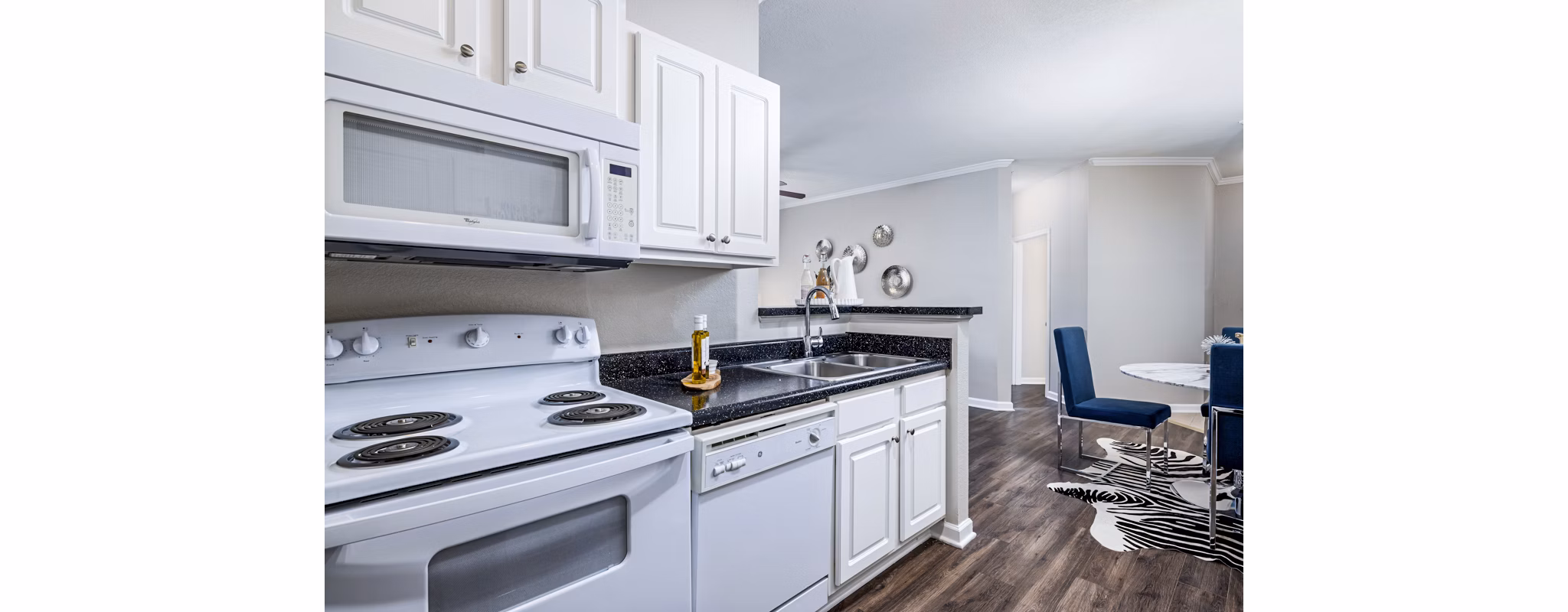 Modern kitchen with stainless steel appliances at Columns at Wakefield luxury apartments