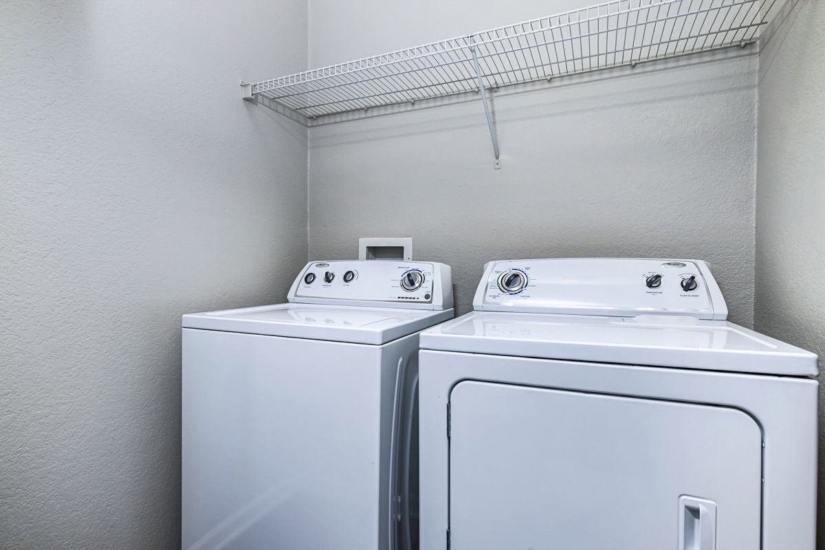Laundry room at Columns At Wakefield Apartments