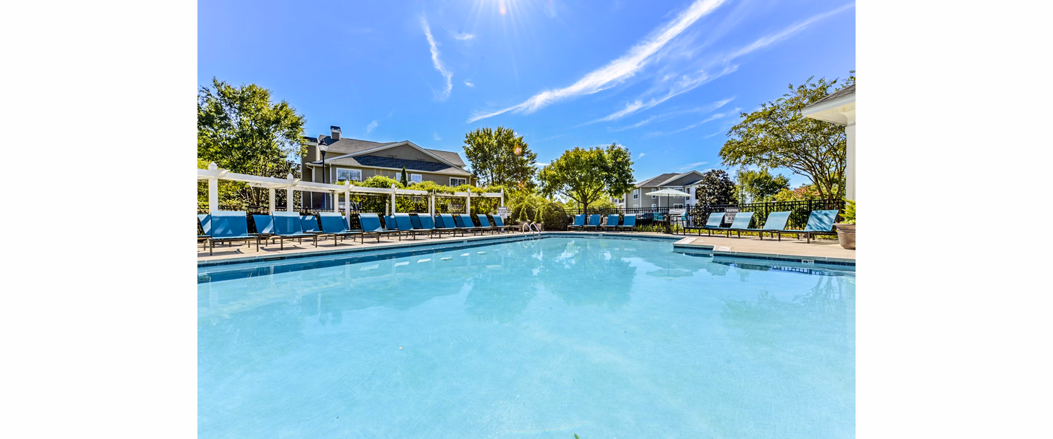 Spacious outdoor pool at Columns at Wakefield Apartments, a luxury community offering modern amenities for relaxation and recreation