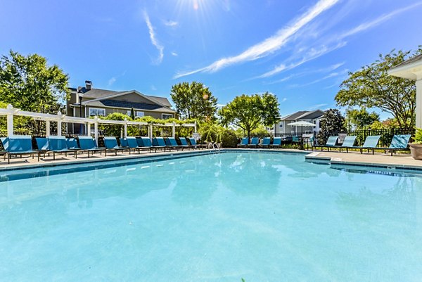 Spacious outdoor pool at Columns at Wakefield Apartments, a luxury community offering modern amenities for relaxation and recreation