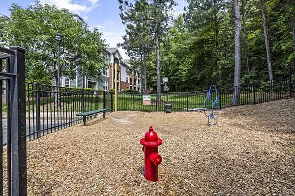 Fenced dog park with agility course at Columns at Wakefield apartments