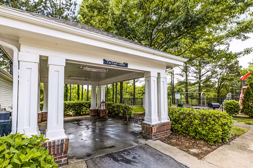 Car wash station with high-pressure hoses at Columns at Wakefield luxury apartments, perfect for vehicle maintenance
