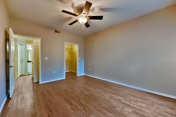 Cozy bedroom with stylish decor at Pinnacle Terrace Apartments, offering comfort and luxury in a prime location