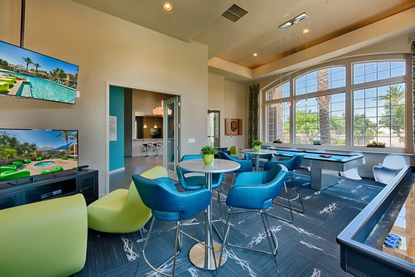Clubhouse at Pinnacle Terrace: Modern recreation space with fireplace and seating areas at luxury apartments in Greystar community