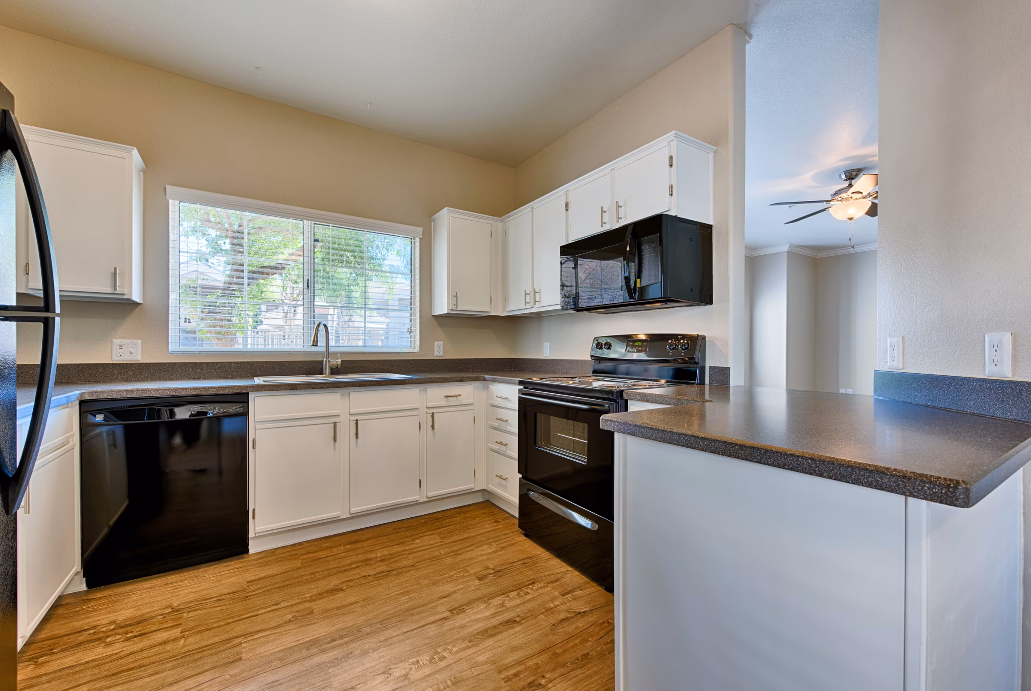 Kitchens with modern appliances and granite countertops at Pinnacle Terrace Apartments, luxury living by Greystar