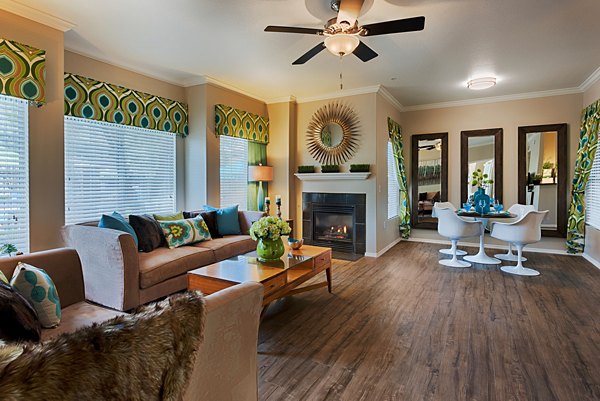 Spacious living room with modern decor in Pinnacle Terrace Apartments: Luxury living by Greystar