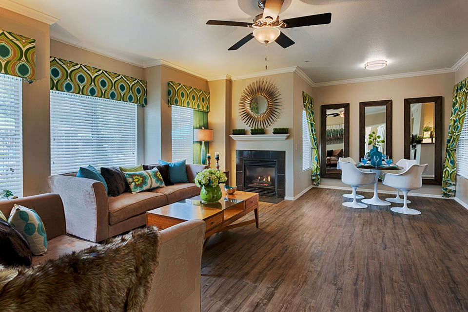 Spacious living room with modern decor in Pinnacle Terrace Apartments: Luxury living by Greystar