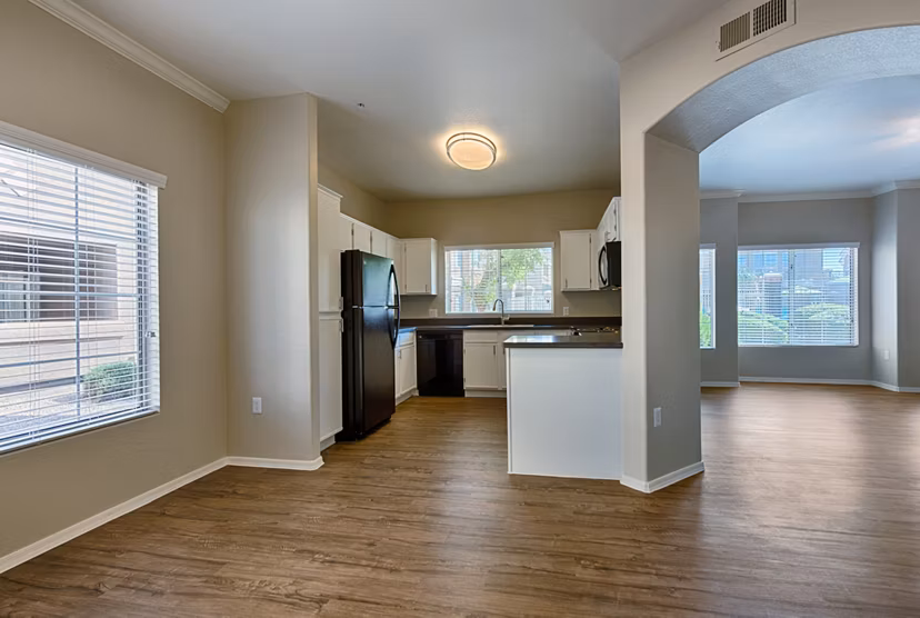 Modern living room with sleek furnishings and natural light at Pinnacle Terrace Apartments