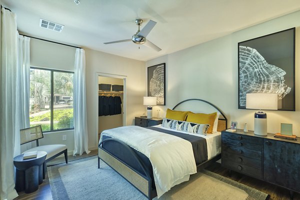 Spacious bedroom with modern design elements at Seven Apartments, offering luxury living by Greystar