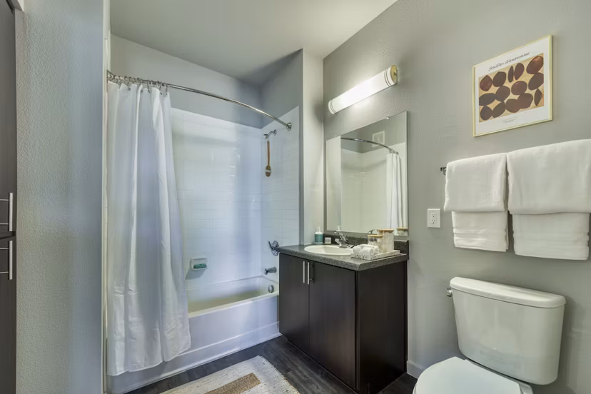Contemporary bathroom with sleek fixtures and marble countertop at Seven Apartments