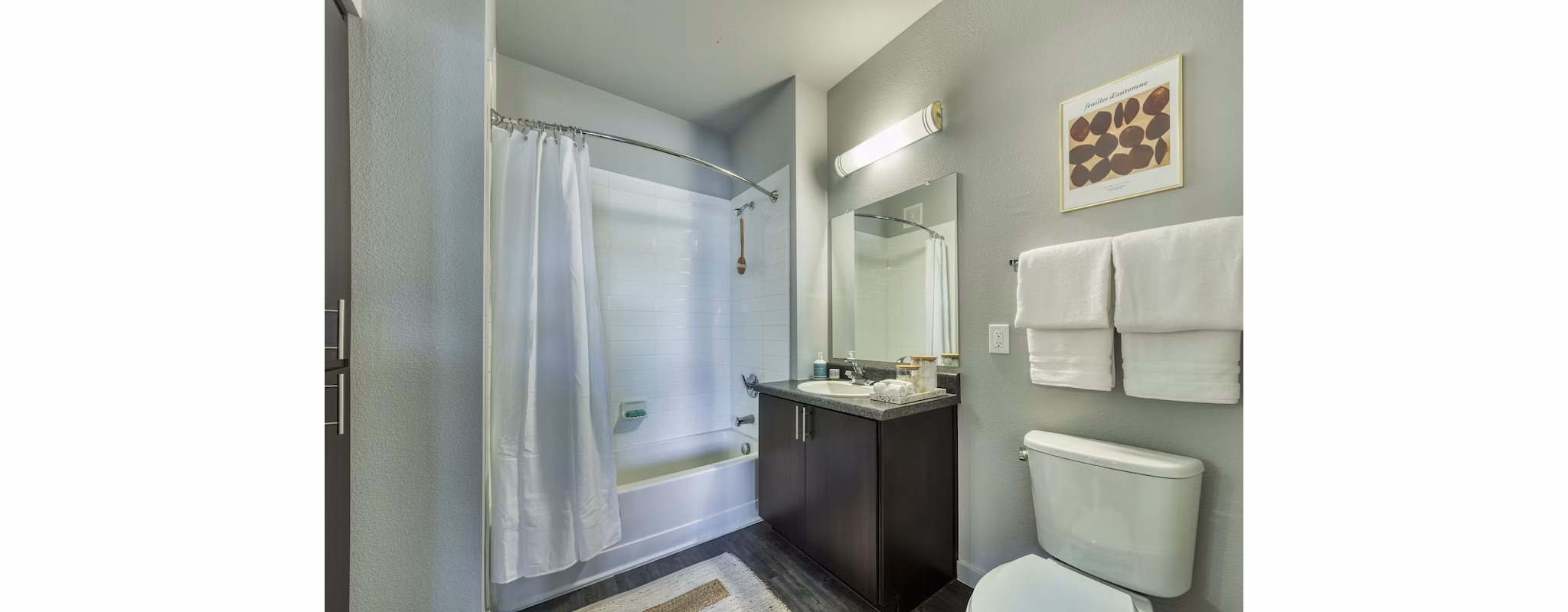 Contemporary bathroom with sleek fixtures and marble countertop at Seven Apartments