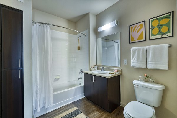 Seven Apartments: Modern bathroom with stylish fixtures in a luxury Greystar property