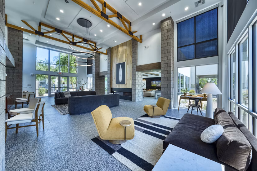 Modern clubhouse with cozy seating and pool table at Seven Apartments, luxury Greystar property ideal for social gatherings in Miami