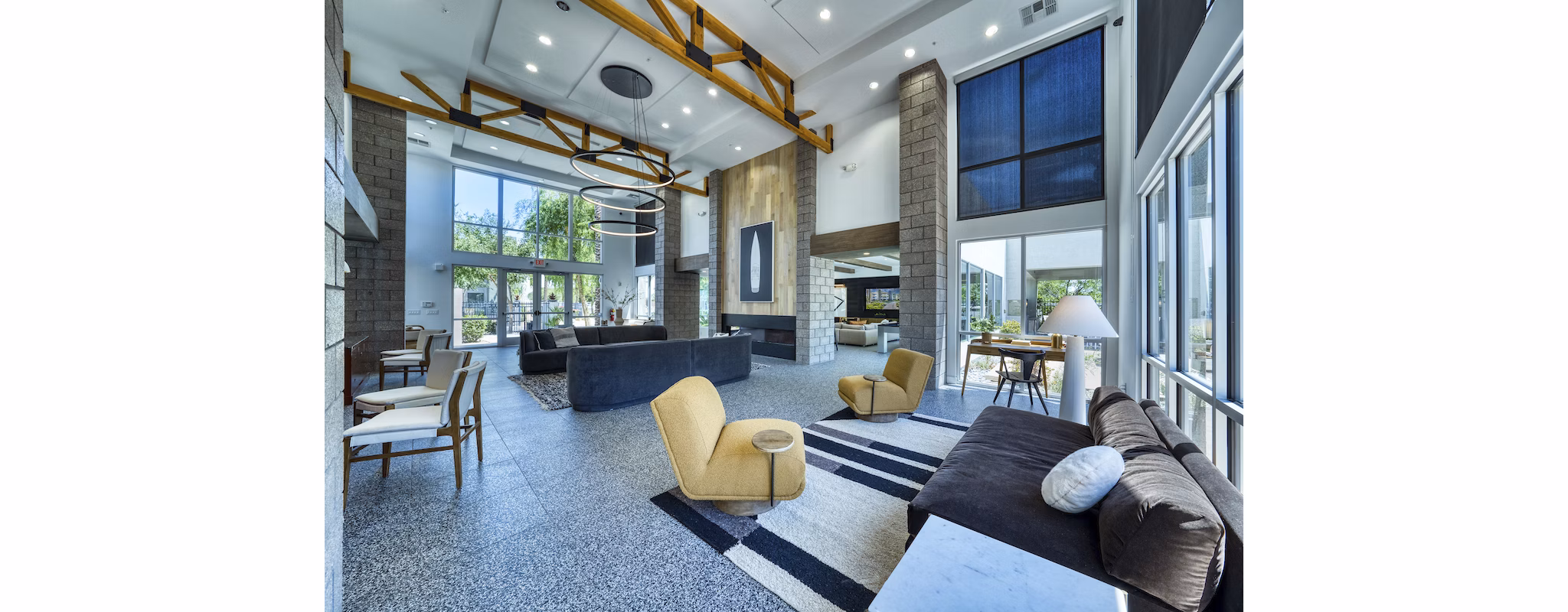 Modern clubhouse with cozy seating and pool table at Seven Apartments, luxury Greystar property ideal for social gatherings in Miami