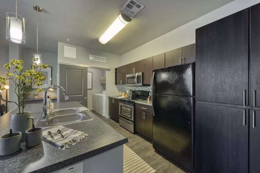 Modern kitchen with stainless steel appliances at Seven Apartments