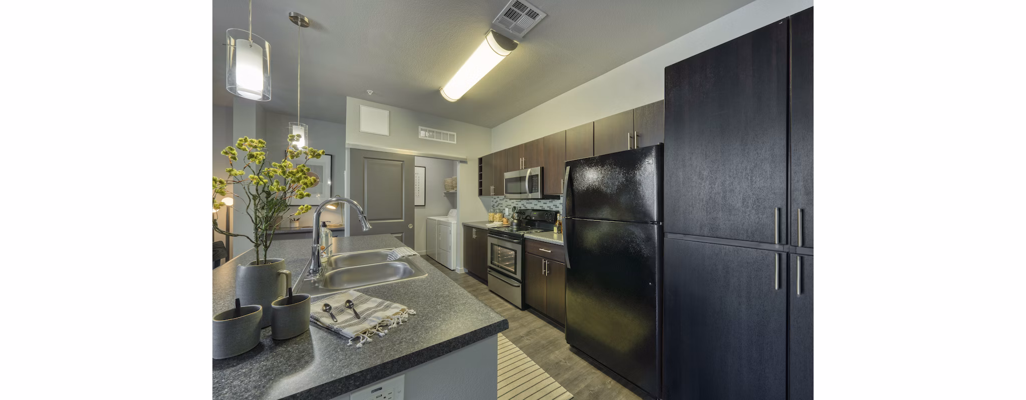 Modern kitchen with stainless steel appliances at Seven Apartments