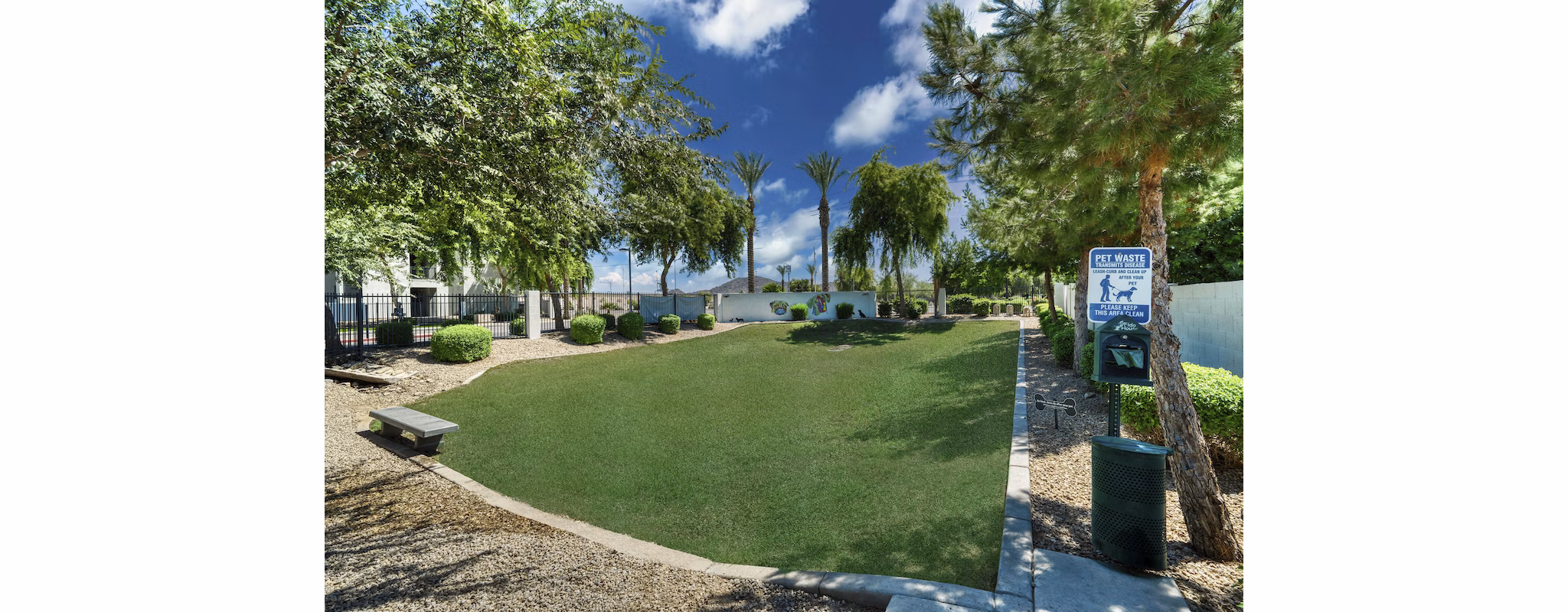 Dog park at Seven Apartments: Spacious fenced area with agility equipment and seating for resident enjoyment