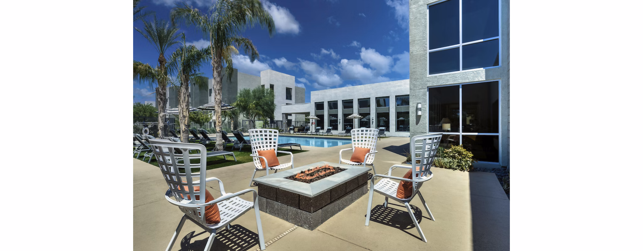 Resort-style outdoor pool area at Seven Apartments