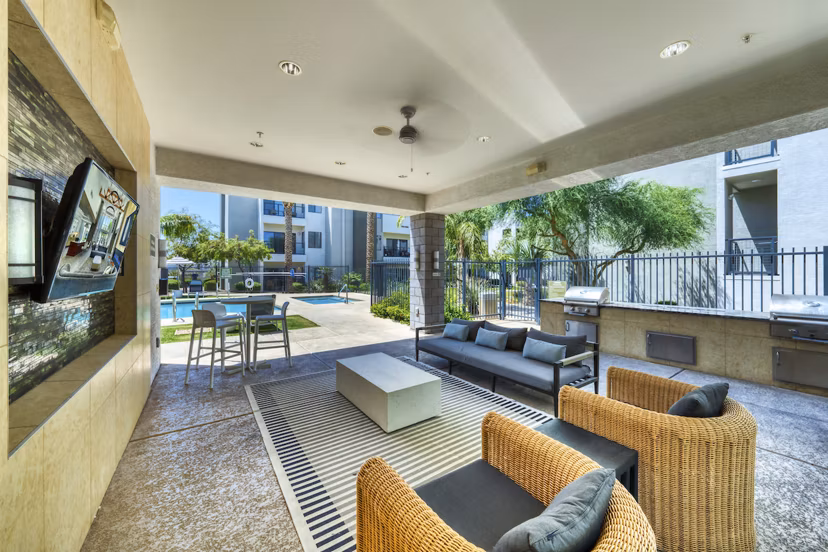 Private patio with outdoor seating at Seven Apartments in luxury living setting