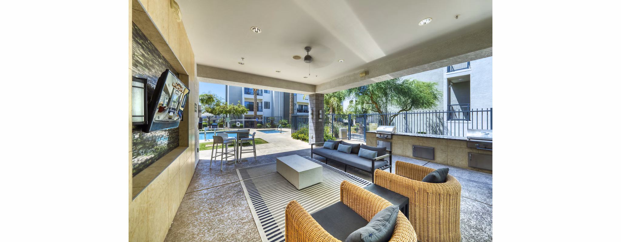Private patio with outdoor seating at Seven Apartments in luxury living setting