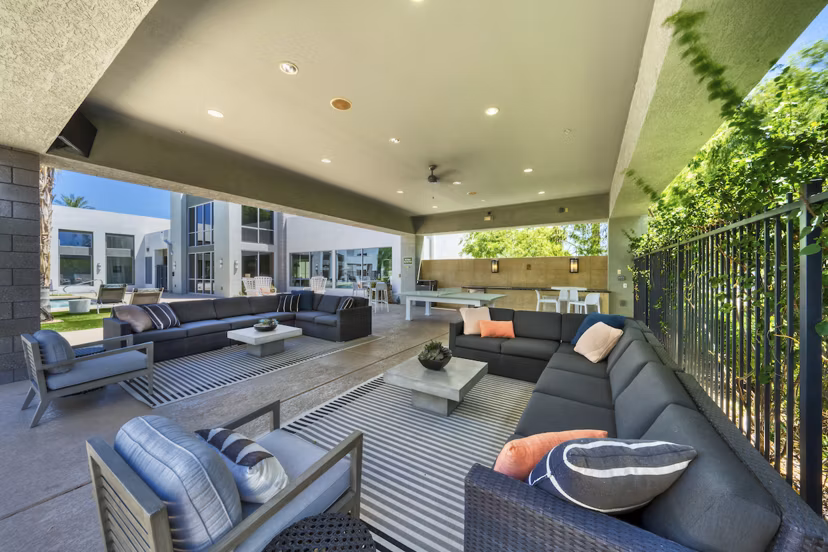 Modern patio with cozy seating at Seven Apartments in a luxury setting, perfect for outdoor relaxation