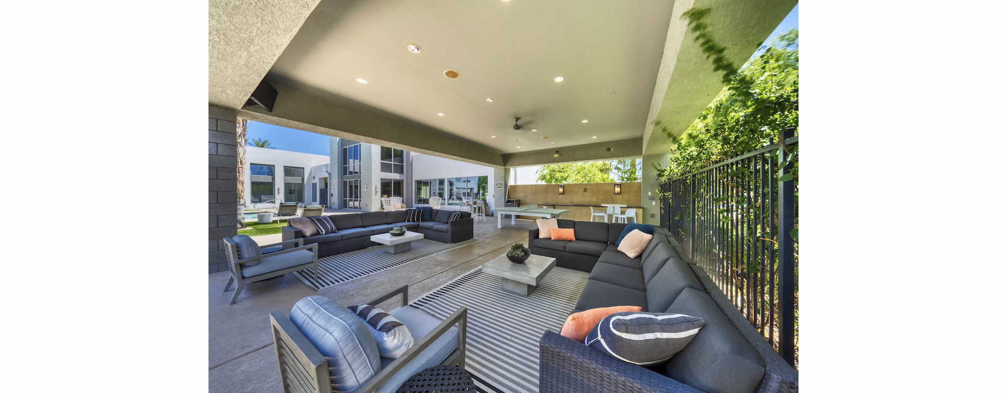 Modern patio with cozy seating at Seven Apartments in a luxury setting, perfect for outdoor relaxation