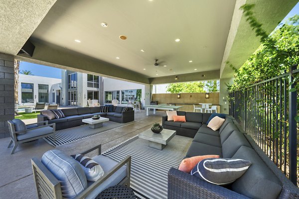 Modern patio with cozy seating at Seven Apartments in a luxury setting, perfect for outdoor relaxation
