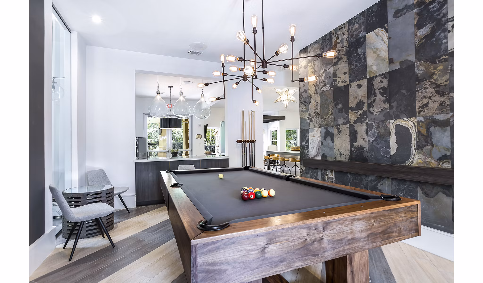 Game room featuring pool table and gaming consoles at Folio Apartments Luxury amenities for relaxation and entertainment in a community setting