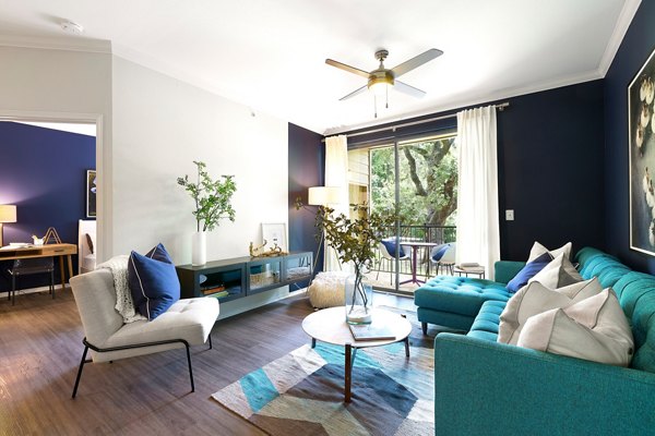 Contemporary living room with stylish furnishings in Folio Apartments, a Greystar luxury community