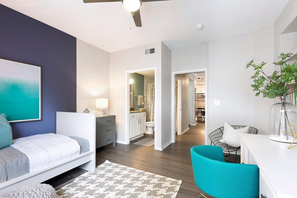 Living room with modern furnishings and natural light in Folio Apartments